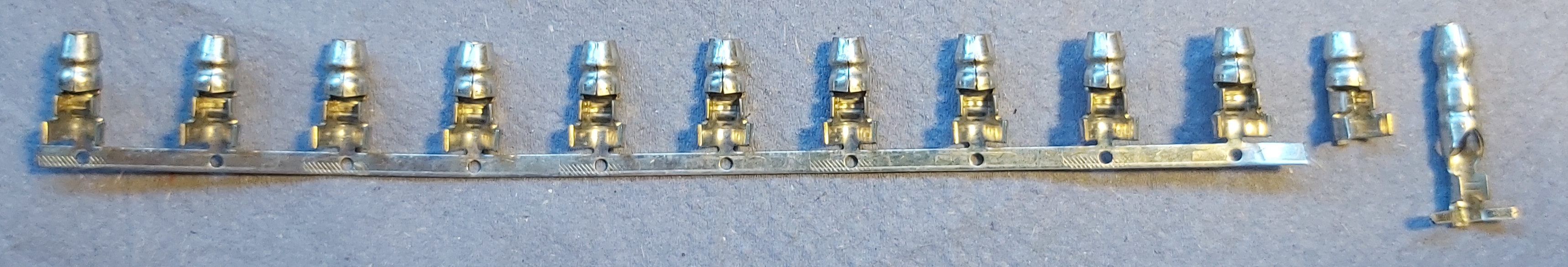 10 F-crimp bullet connectors strip, with one single similar and one Durite longer type.